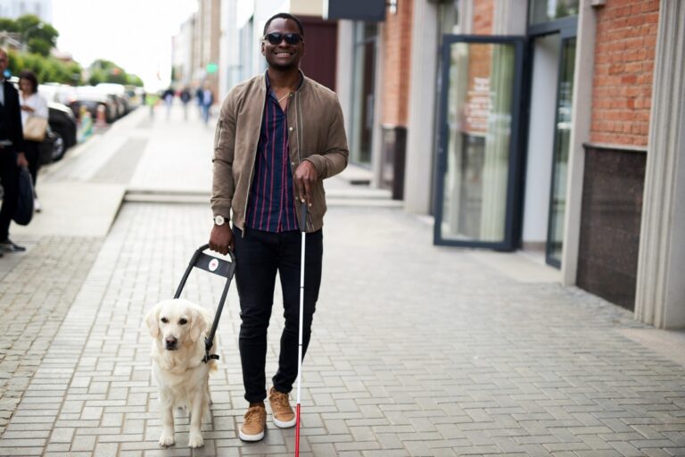 Blind man walking with dog, shopping at accessible stores